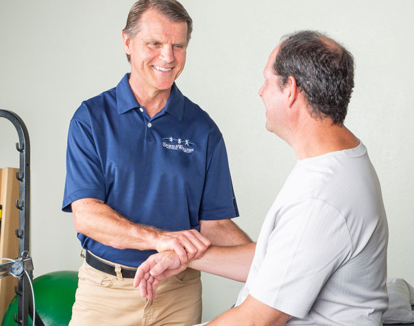 Doctor holding patient's arm